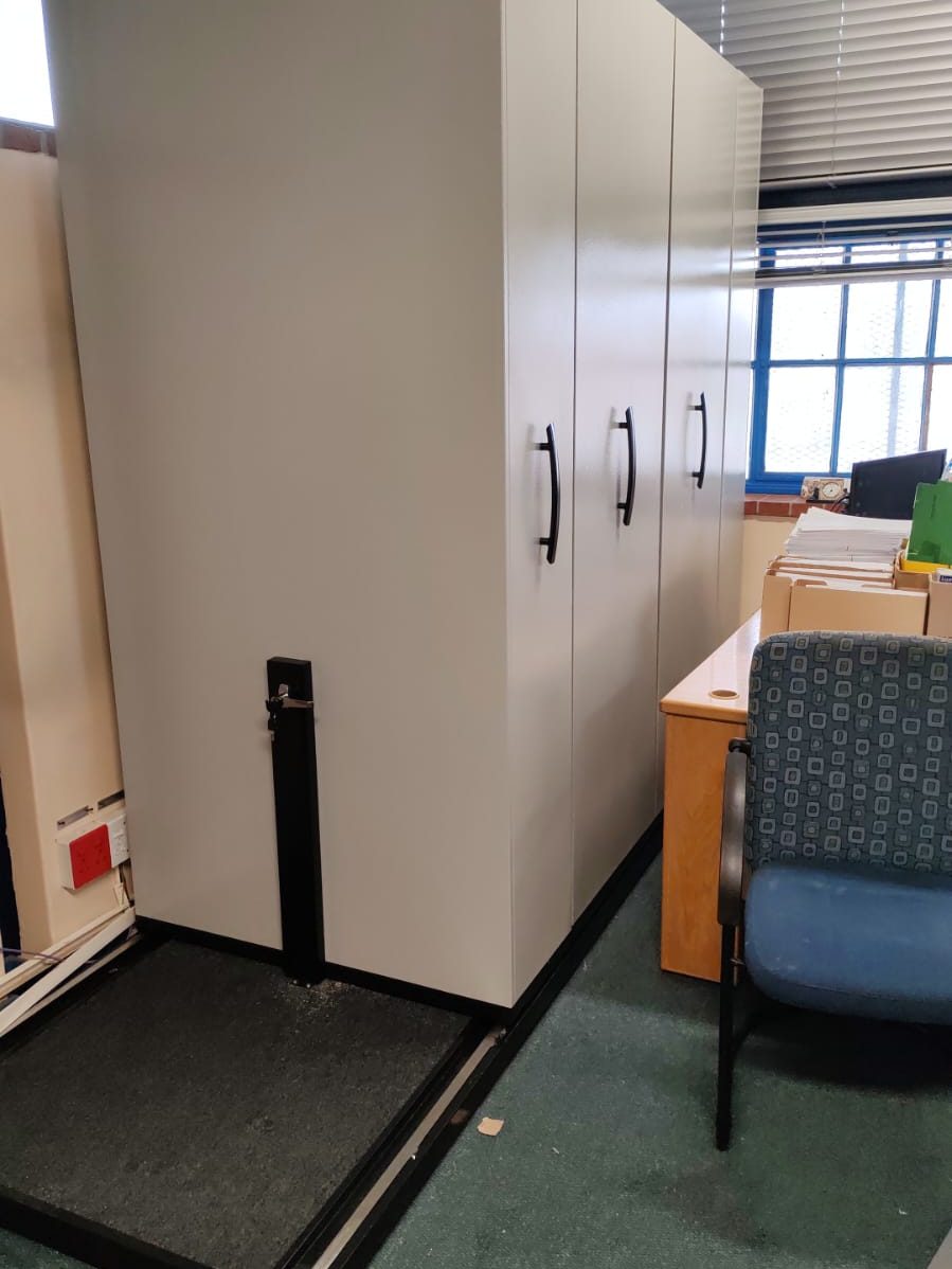 Mobile shelving installed alongside office seating